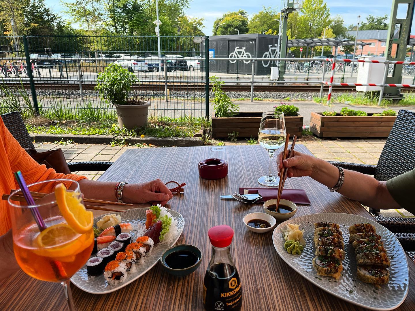 two people eating sushi